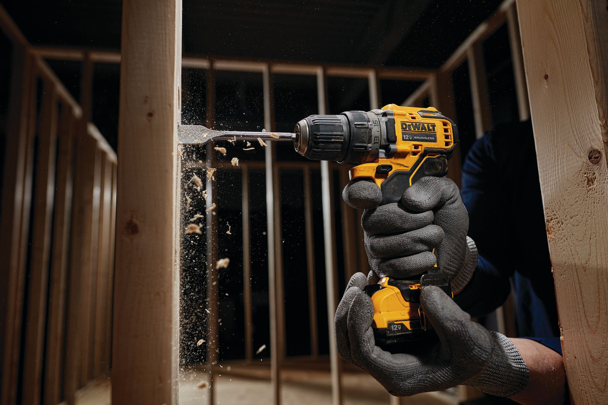 12V XR Brushless Sub-Compact Drill Driver drilling hole through wooden wall framework