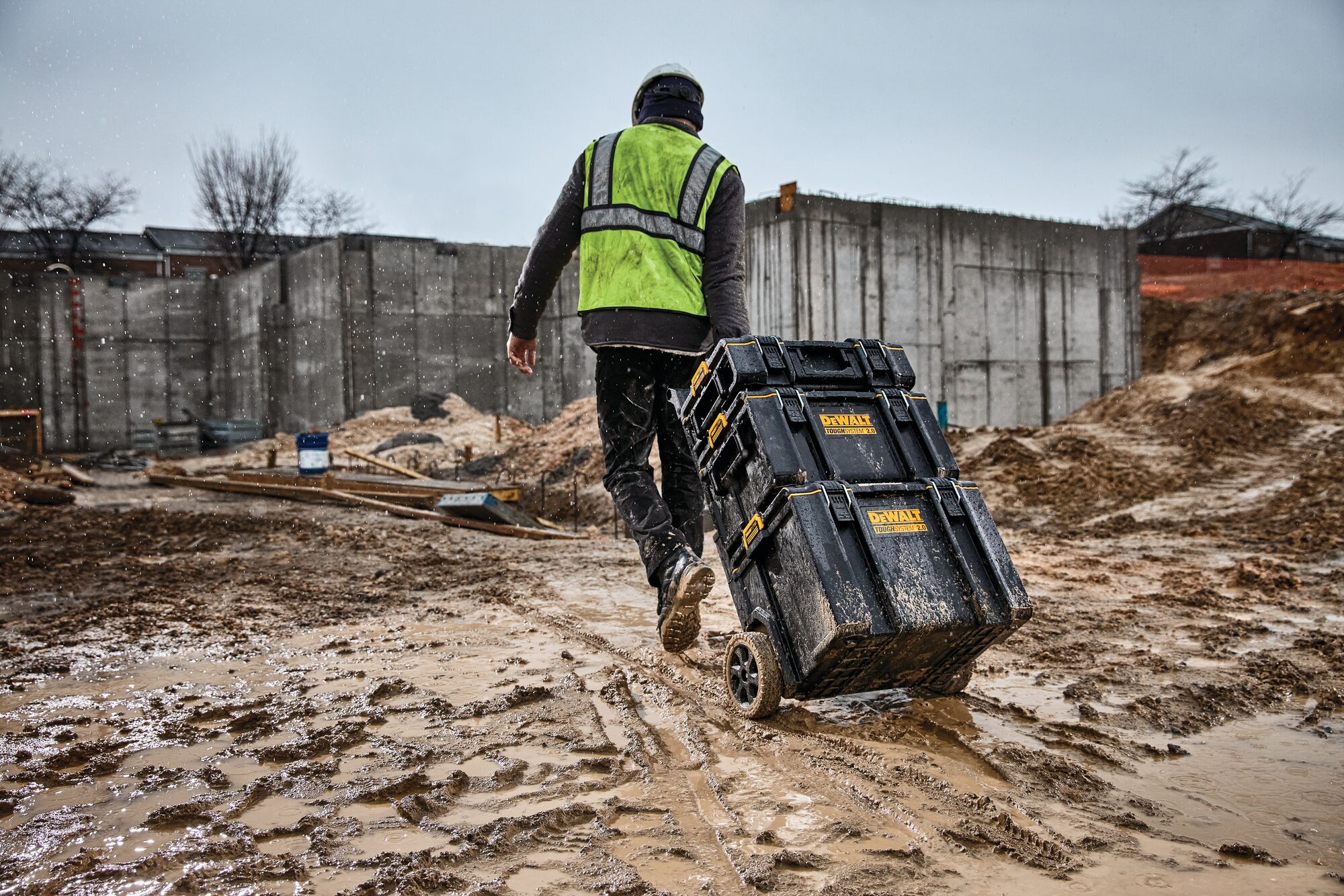 tough system 2.0 toolbox being taken to a different area of worksite by a worker.