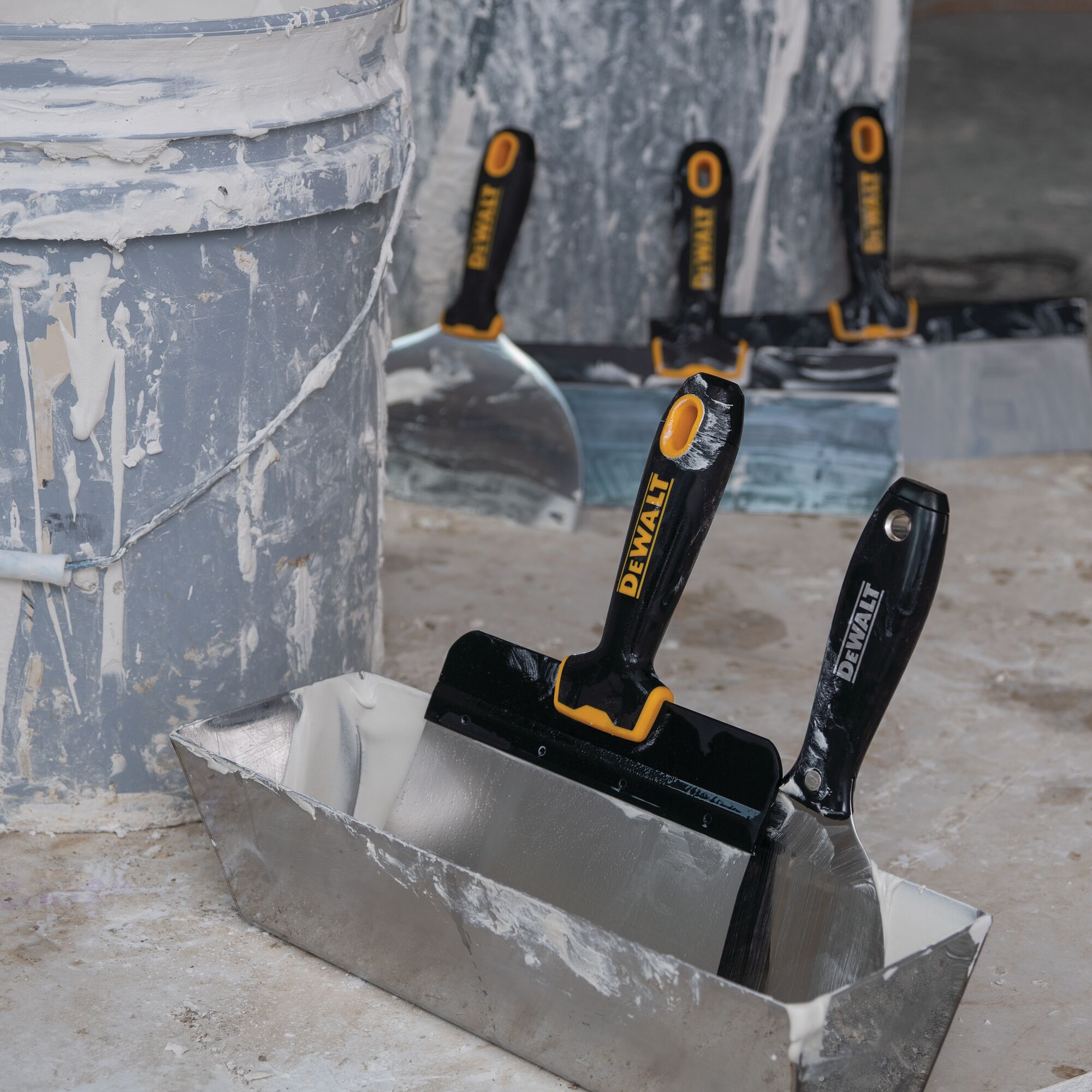 Close up of the Stainless Steel Drywall Mud Pan on a painting site.